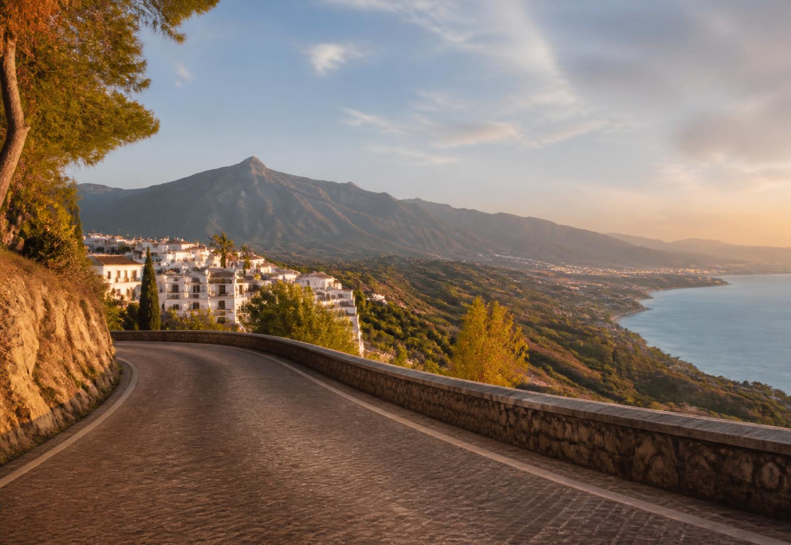 Coastal road above the Mediterranean near Marbella at golden hour